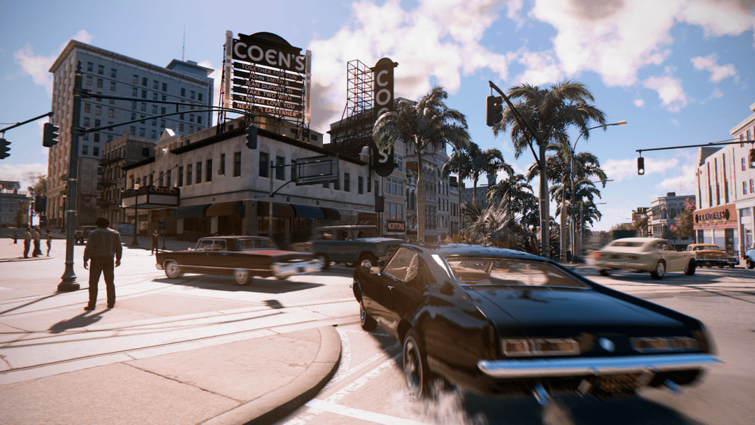 Rue de New Bordeaux dans Mafia III avec immeubles, hôtels et voitures années 1960 en libre circulation