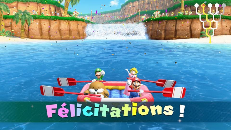 Personnages de Super Mario Party en bateau rose sur une rivière, pagayant avec des rames, avec le message « Félicitations ! »