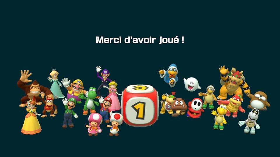 Écran de fin de Super Mario Party montrant des personnages de l'univers Mario autour d'un dé numéroté 1 avec le texte « Merci d'avoir joué »