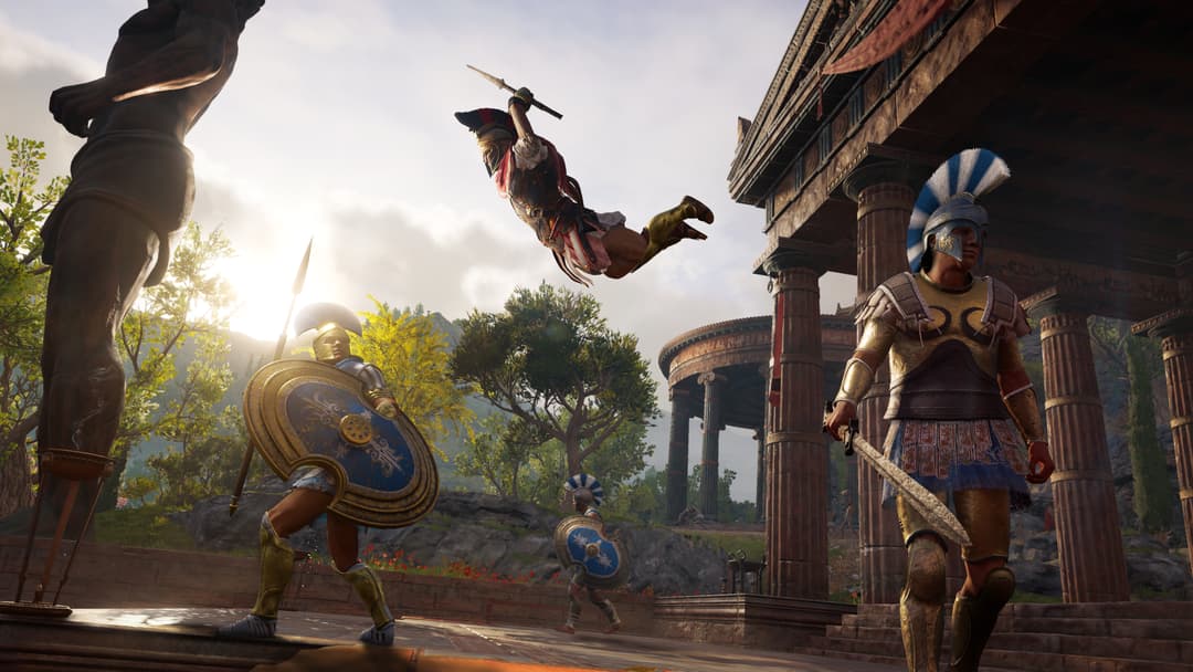 Scène de combat dans Assassin's Creed Odyssey avec guerriers grecs en armure affrontant un assassin qui saute dans les airs, devant des ruines antiques
