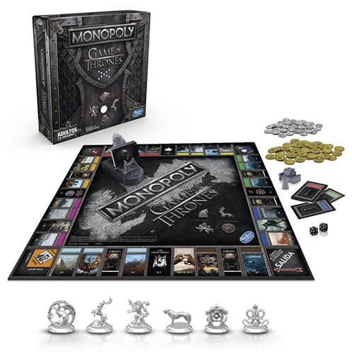 Monopoly Game of Thrones avec plateau thématique, pions représentant les maisons de Westeros, monnaie en dragons et pièces d'argent, et boîte noire illustrée