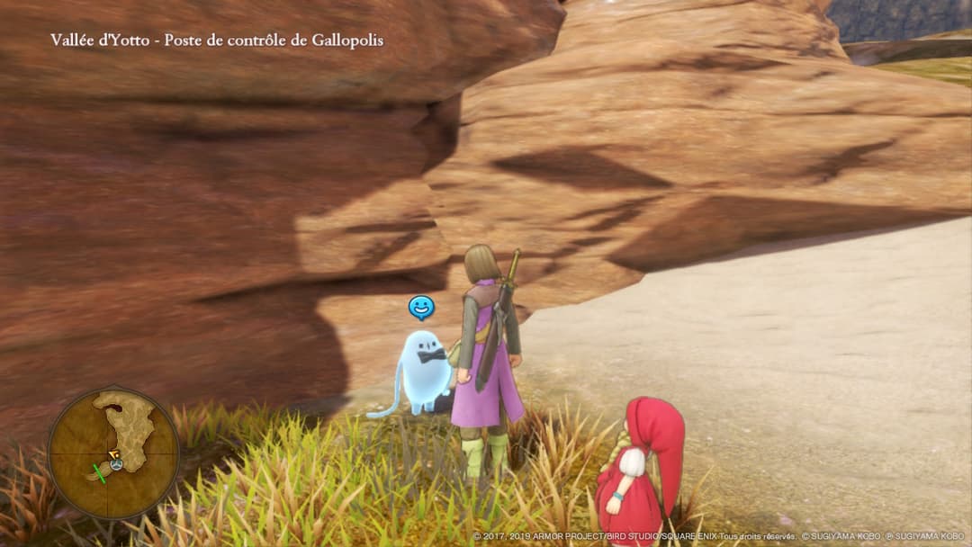 Capture d'écran de Dragon Quest XI S montrant une fillette en robe violette et un personnage fantôme dans une vallée rocheuse