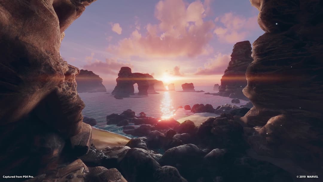 Capture d'écran de Marvel's Iron Man VR montrant un paysage côtier rocheux au coucher de soleil, vue depuis une grotte