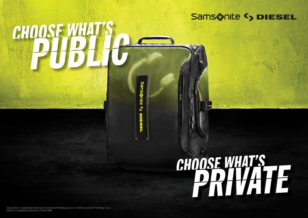 Valise noire et vert fluo Samsonite x Diesel avec sangles, sur fond jaune et noir avec logos des deux marques