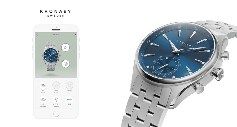 Montre connectée Kronaby Sekel avec boîtier en acier inoxydable, cadran bleu, bracelet argenté mailles, affichée aux côtés d'un smartphone blanc