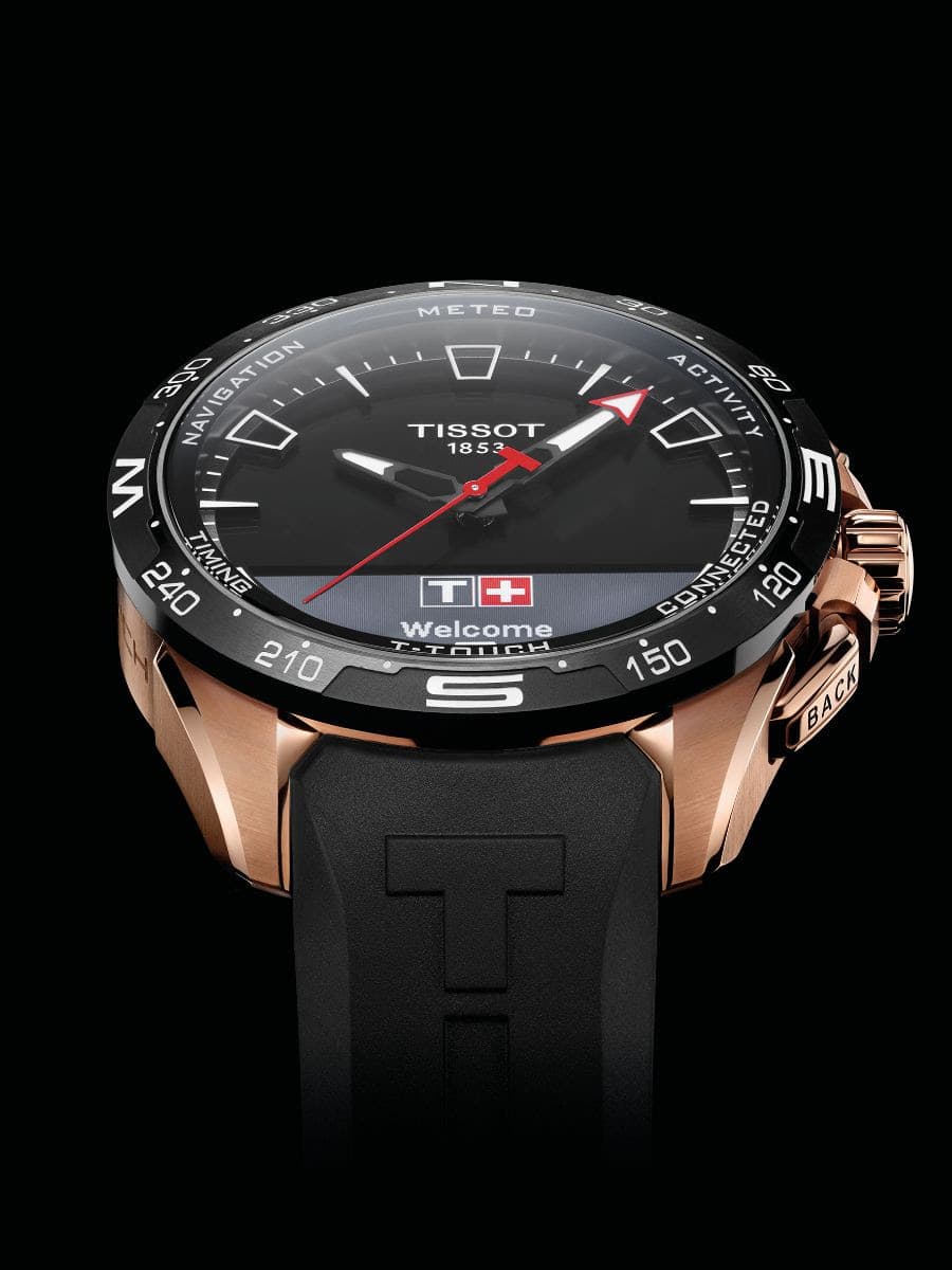 Montre Tissot T-Touch Connect Solar avec boîtier or rose, cadran noir et aiguilles rouges, bracelet noir
