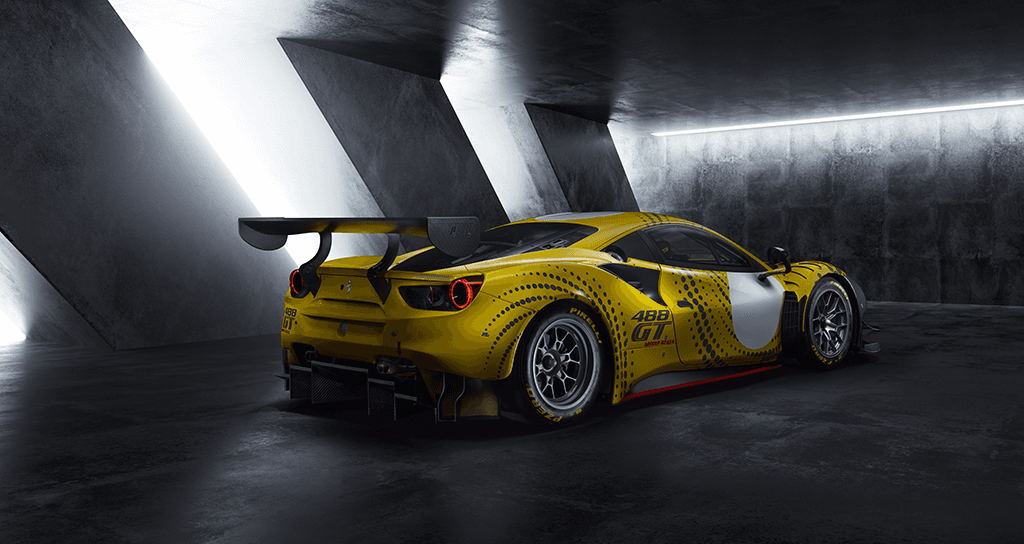 Ferrari 488 GT Modificata jaune avec aileron surdimensionné, photographiée de trois quarts arrière dans un garage moderne