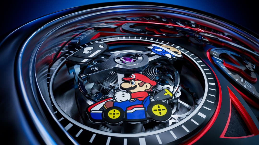Montre Tag Heuer Formula 1 × Mario Kart avec cadran noir affichant Mario au centre, entouré de index lumineux et de lunette bleue et rouge