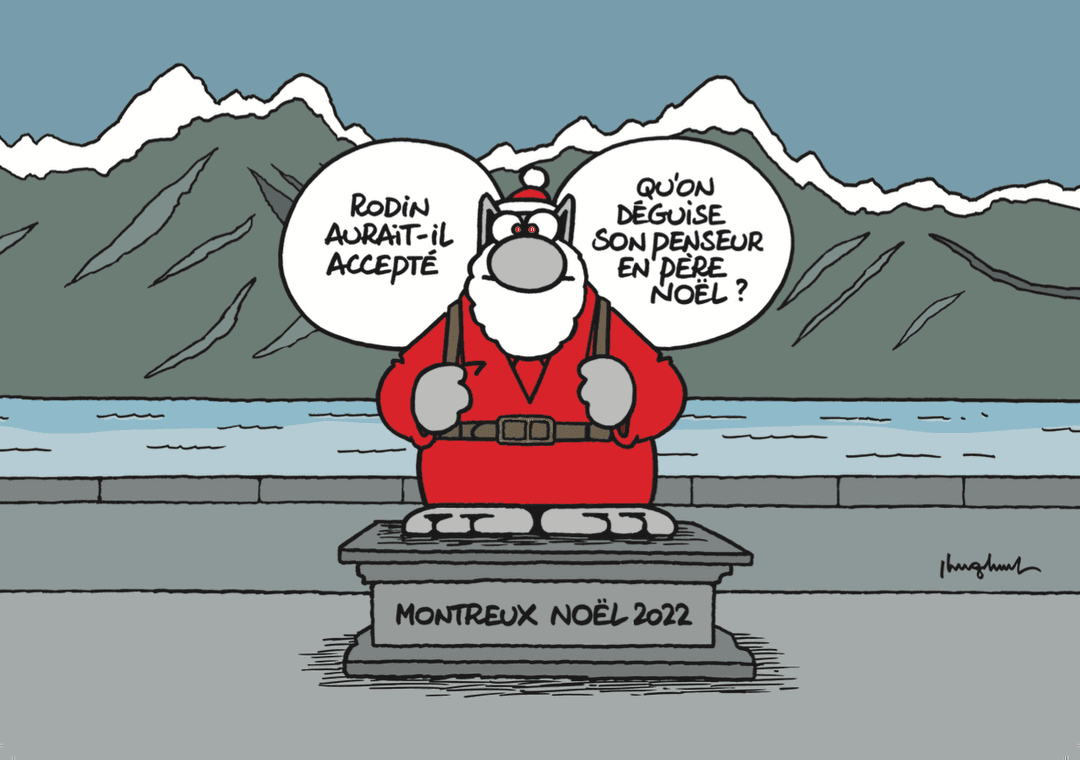 Le Chat de Philippe Geluck déguisé en Père Noël sur un socle au bord du lac de Montreux, devant les montagnes enneigées