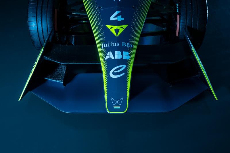 Monoplace de Formule E Cupra-ABT vue de haut, carrosserie bleu foncé avec détails en vert fluorescent et logos des partenaires