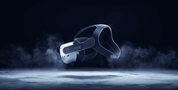 Casque Meta Quest 2 de couleur noire et blanche flottant au-dessus d'une surface futuriste bleue