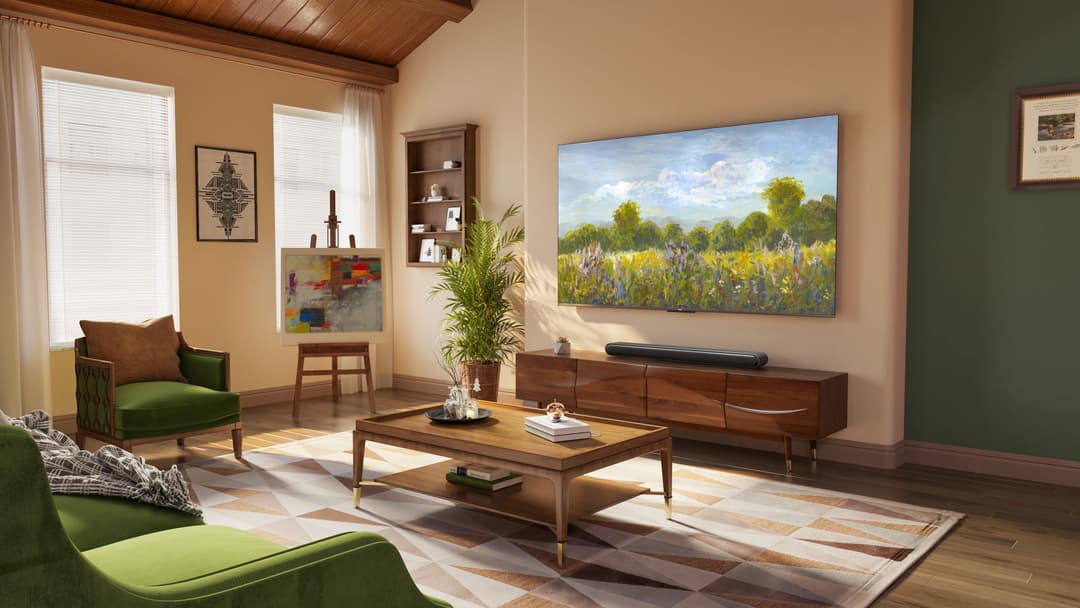 Téléviseur TCL QLED C64 affichant un paysage de champs fleuris, installé dans un salon moderne aux murs beige avec mobilier en bois