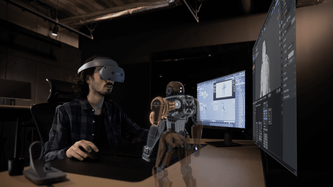Créateur utilisant un casque de réalité étendue pour modéliser un personnage 3D affiché à l'écran