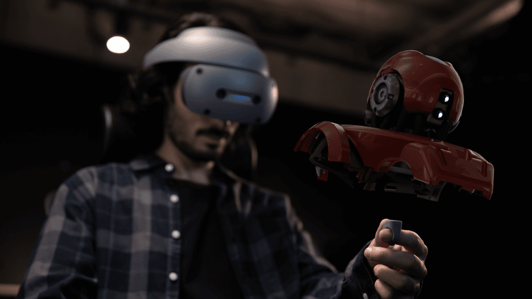 Homme portant un casque de réalité virtuelle manipulant un objet 3D rouge flottant devant lui avec un contrôleur annulaire