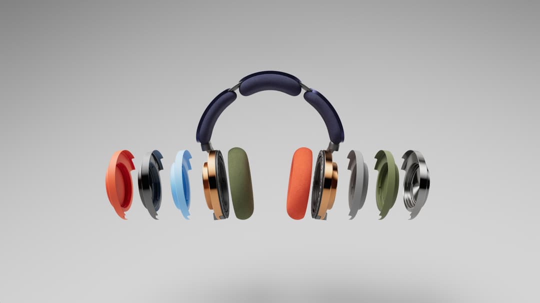 Casque audio Dyson OnTrac avec ses écouteurs détachables présentant diverses couleurs rouge, noir, bleu, cuivre, vert et gris