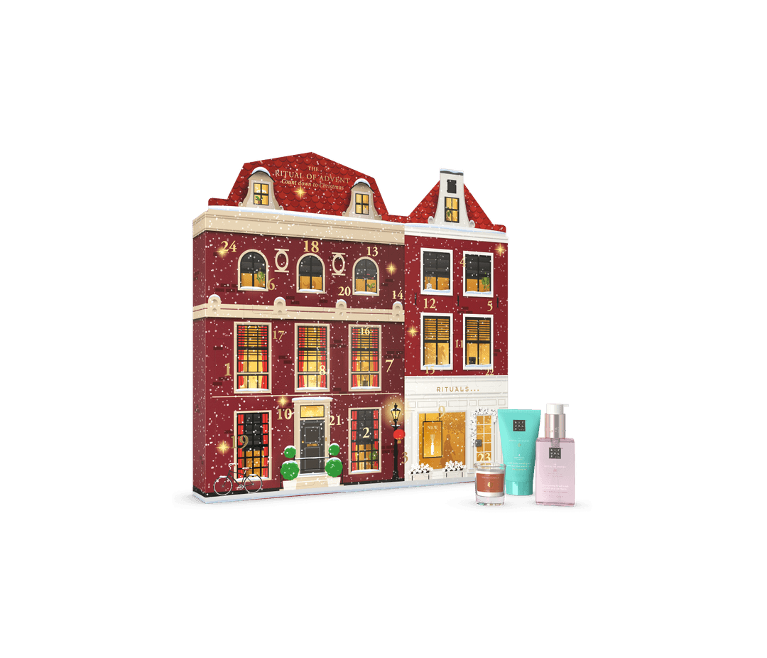 Calendrier de l'Avent RITUALS en forme de maison rouge et blanche avec 24 fenêtres numérotées, accompagné de produits cosmétiques