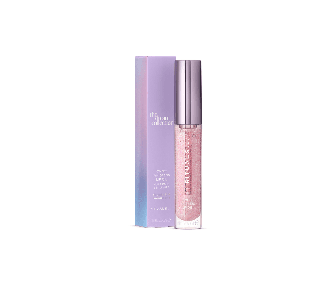 The Dream Collection Lip Oil de Rituals, flacon rose nacré avec pompe et boîte violette dégradée bleu