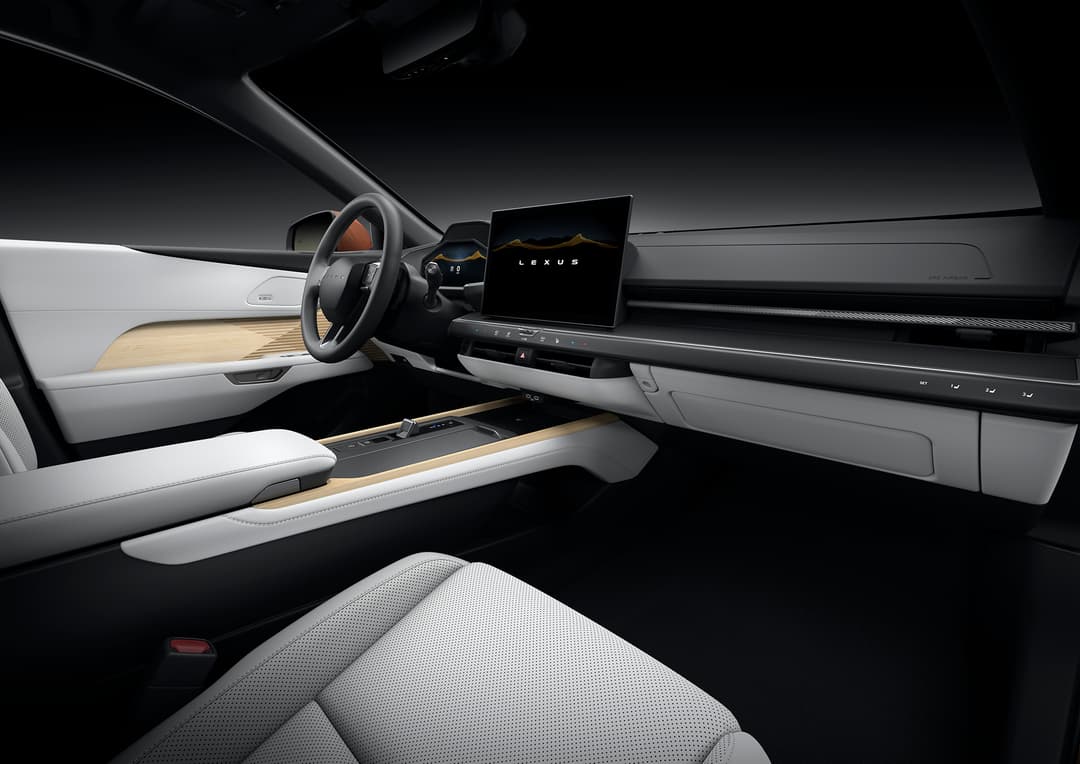 Habitacle de la nouvelle Lexus ES avec tableau de bord épuré, commandes tactiles intégrées et écran central illuminé, habillage blanc et beige