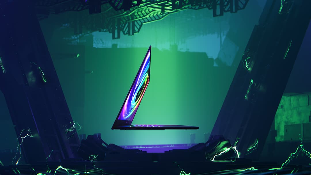 Razer Blade 14 ultraplat avec écran luminescent bleu et rose, posé dans un environnement futuriste aux tons verts et bleus