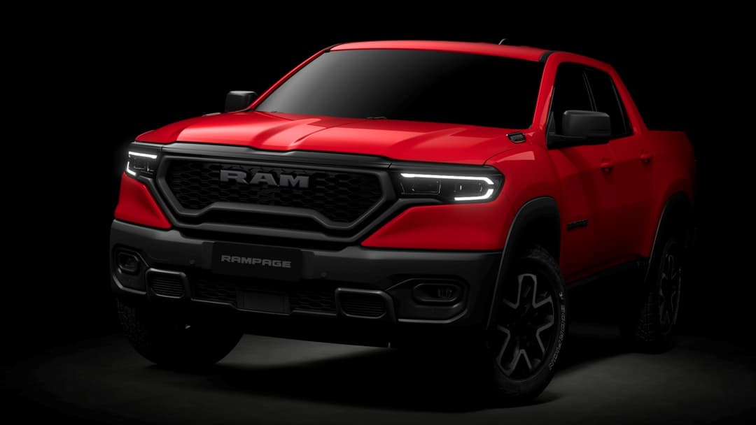Pickup RAM Rampage rouge vif présenté de profil sur fond noir, avec phares LED et calandre noire caractéristique