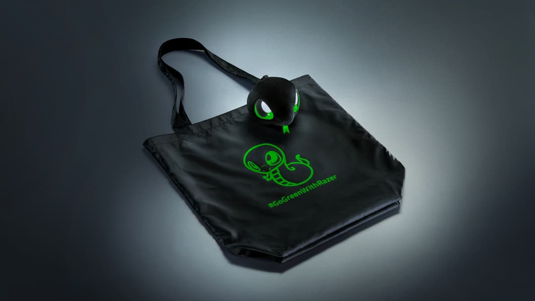 Sac réutilisable noir Sneki Snek avec logo serpent vert fluorescent et mascotte assortie aux yeux brillants