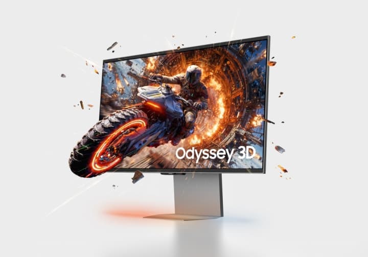Moniteur Samsung Odyssey 3D affichant une scène de jeu 3D dynamique avec une moto et des effets de feu, débris volants autour de l'écran