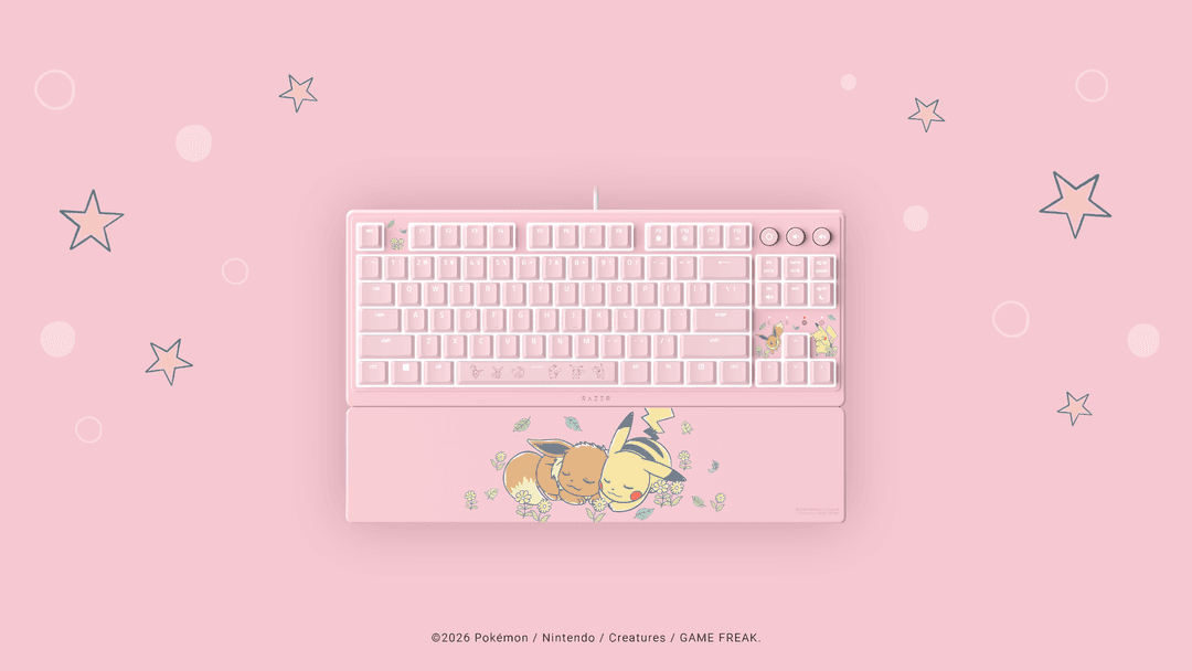 Clavier Razer Ornata V3 Tenkeyless édition Pikachu & Évoli rose pâle avec repose-poignets, sur fond rose avec étoiles
