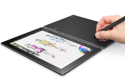 Lenovo Yoga Book, tablette hybride noire avec clavier tactile et stylet, affichant des dessins colorés sur l'écran