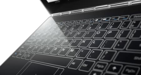 Tablette hybride avec clavier sans touches physiques, affichage tactile gravé sur surface plate