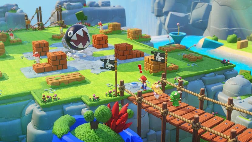 Niveau du jeu Mario et les Lapins Crétins montrant des îles colorées avec briques orange, passages en bois et créatures du Royaume Champignon