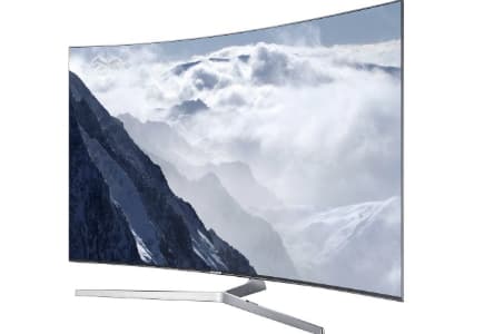 Téléviseur Sony incurvé affichant un paysage montagneux enneigé, vue de face sur socle gris